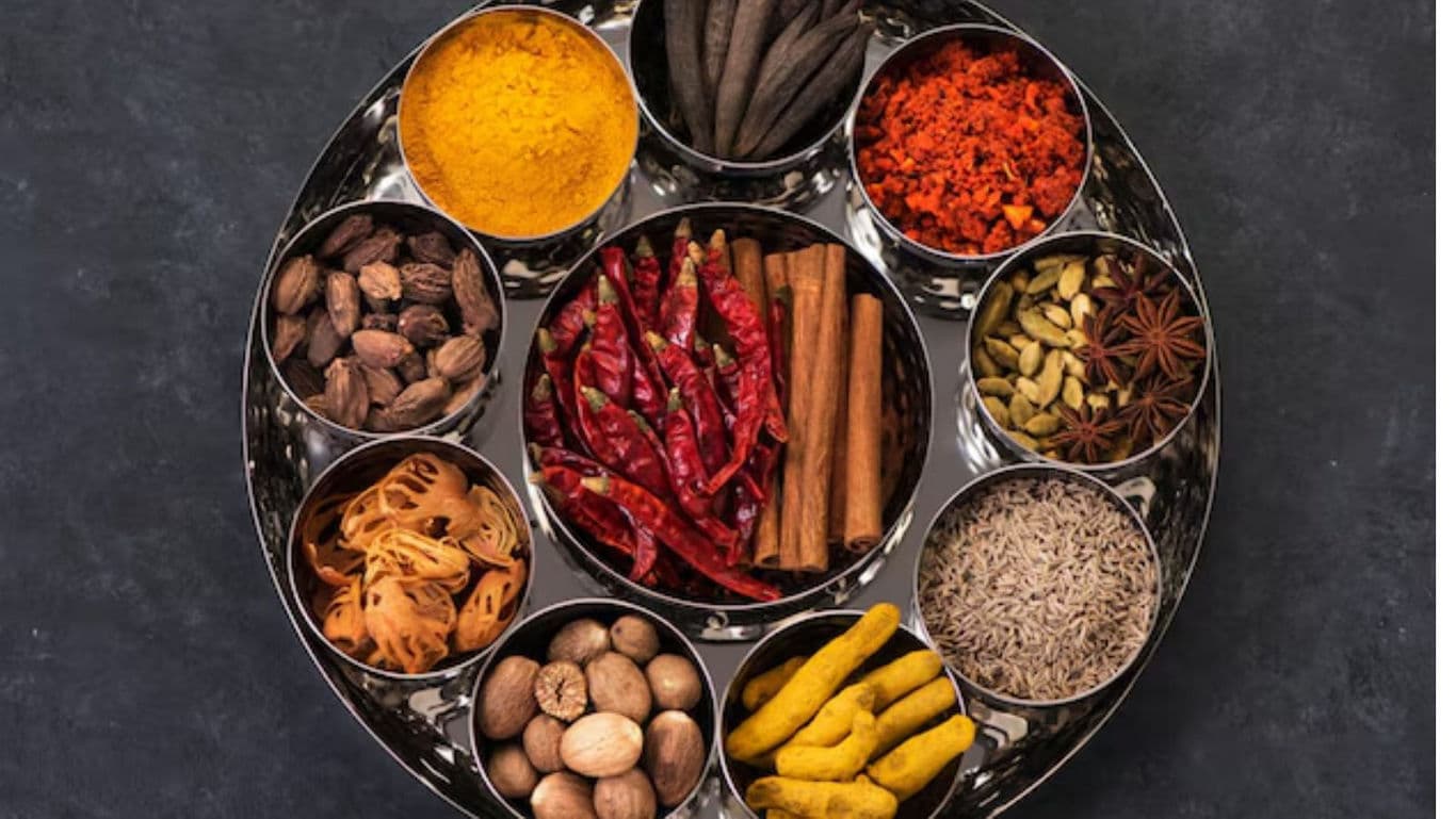 Assorted Indian spices in steel platter