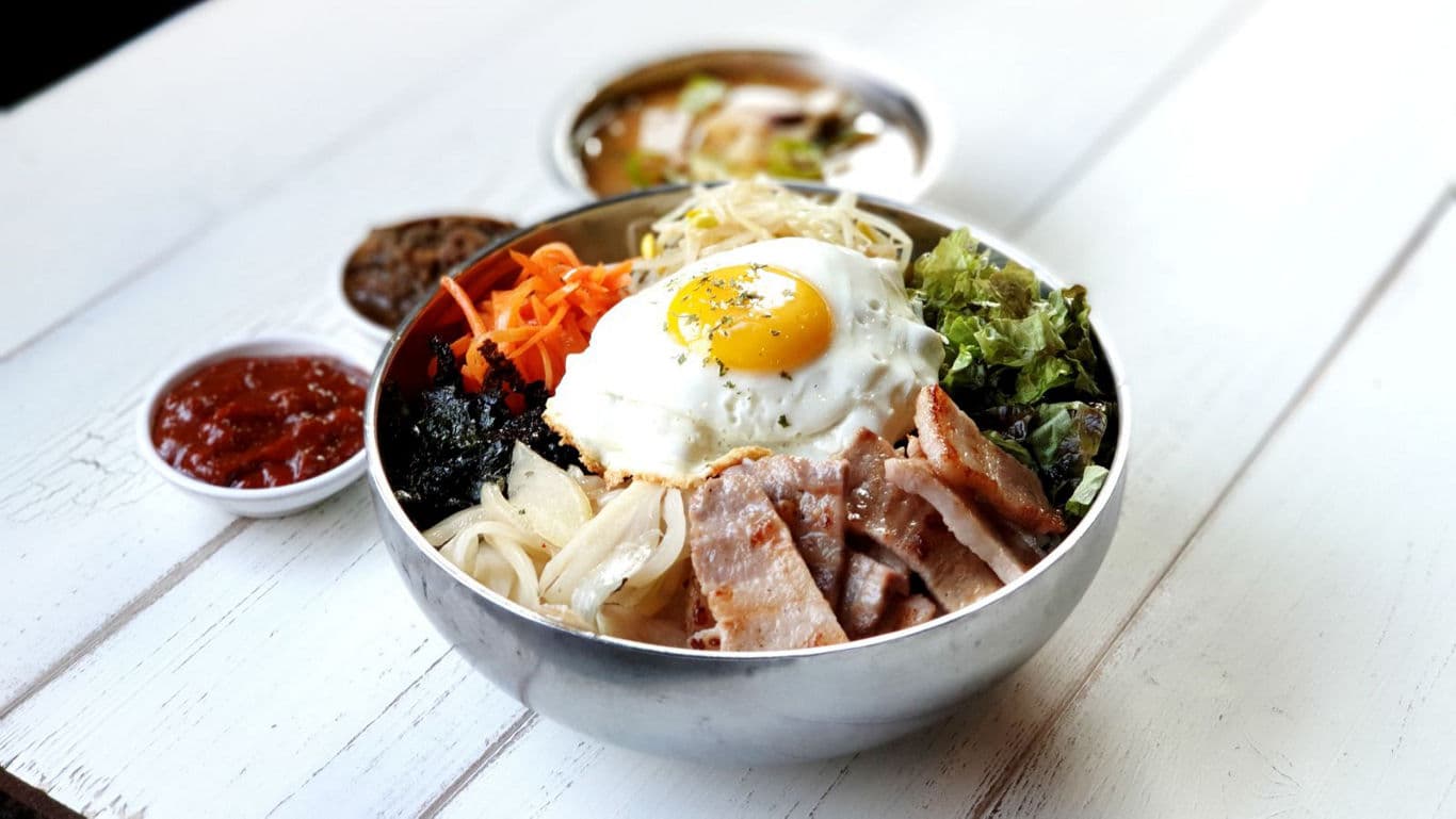 Korean rice bowl with grilled pork and fried egg