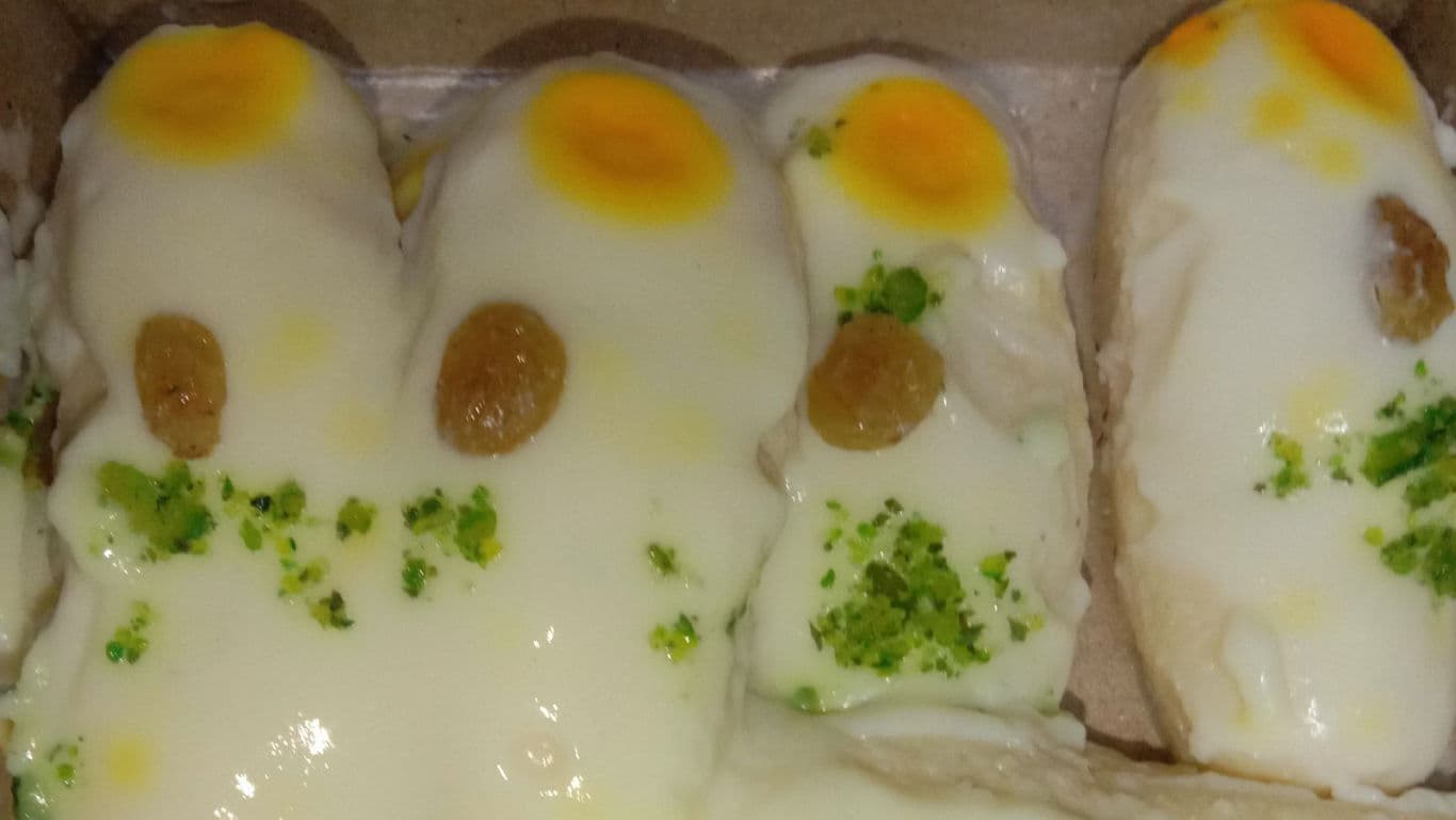 Sweet bread with icing and toppings