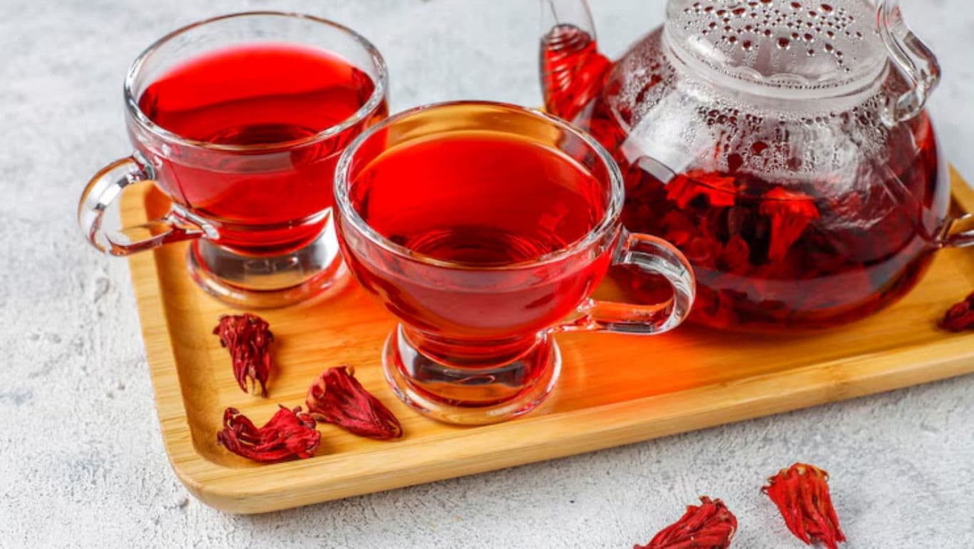 Hibiscus tea in glass cups and teapot